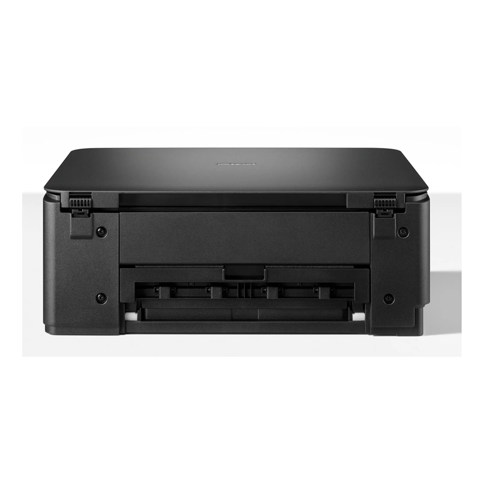 Imprimante Brother DCP-J1310DW posée sur un bureau bois clair avec une plante en arrière-plan