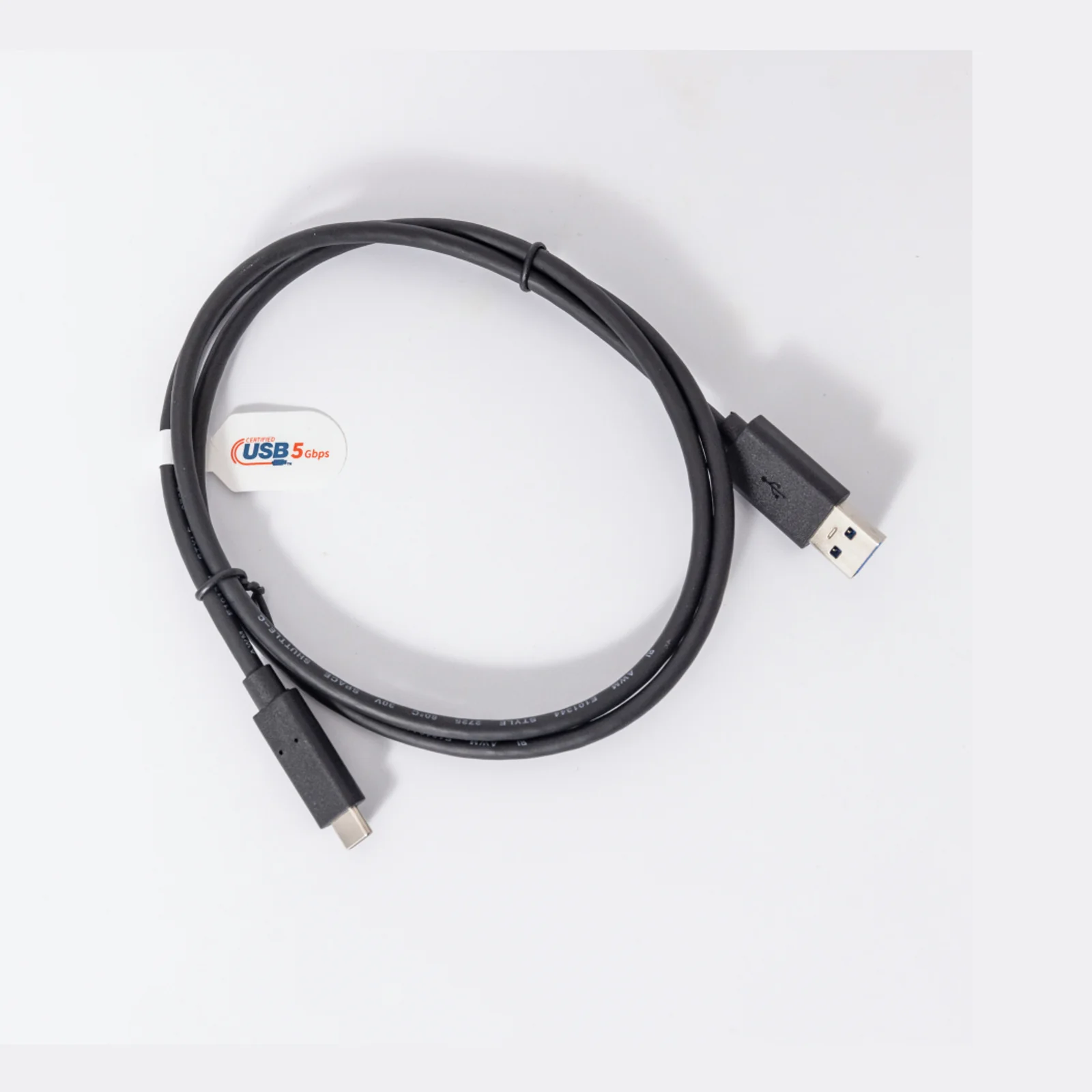 Adaptateur secteur Brother LK-1001C vu de face, bloc noir avec prise UK intégrée et étiquette de spécifications