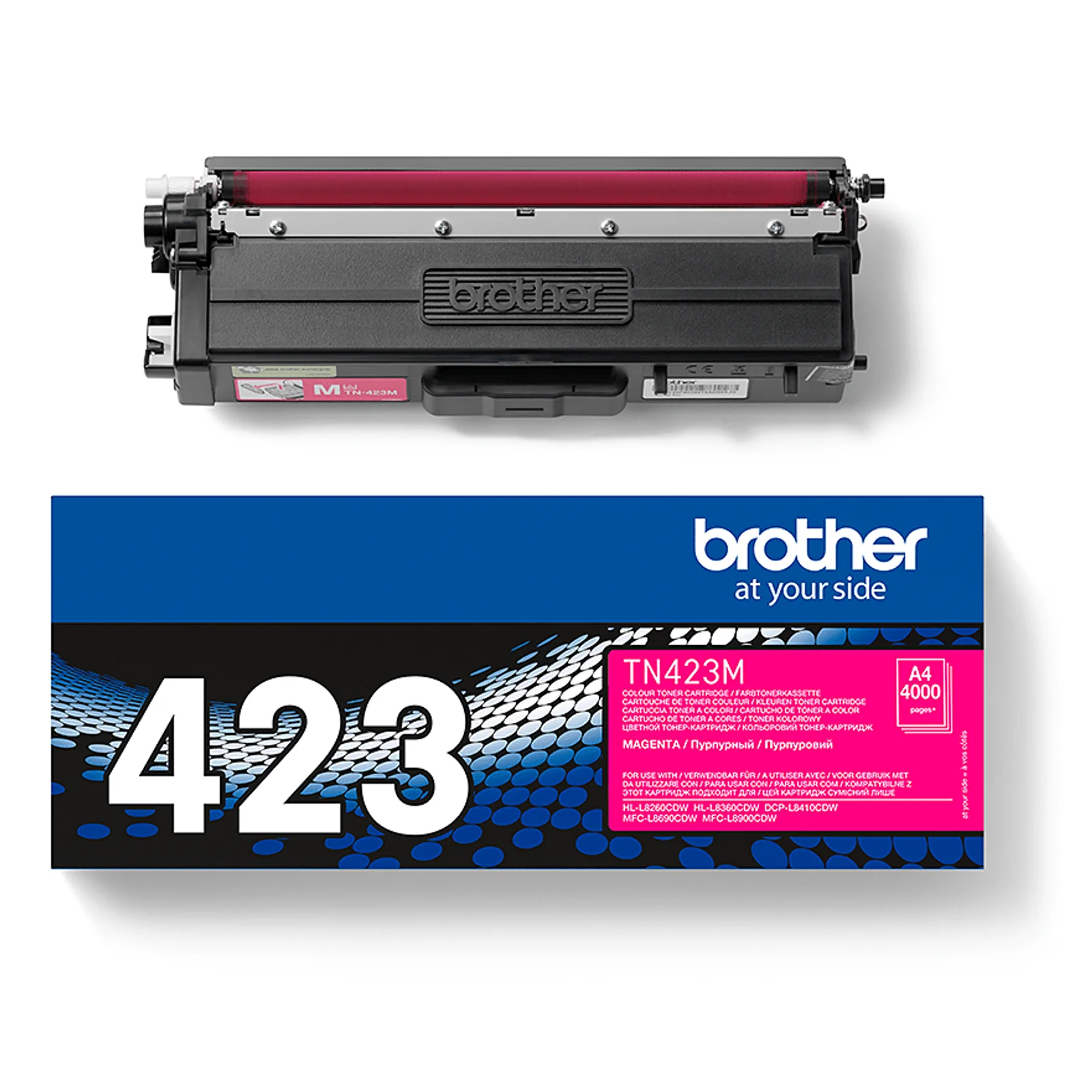Cartouche TN-423M magenta posée au-dessus de la boîte d'emballage Brother bleue