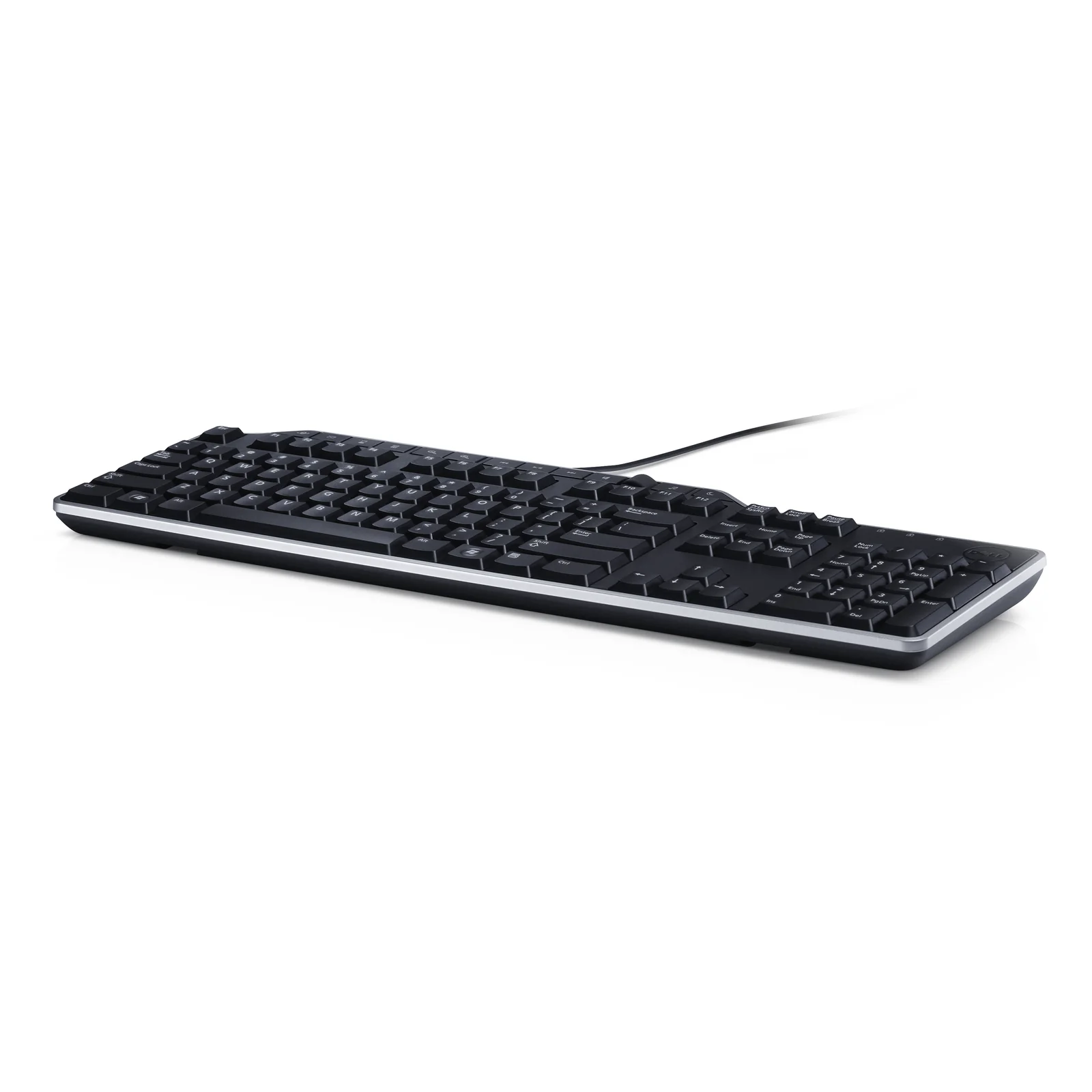 Vue trois quarts du clavier noir posé à plat avec câble USB dirigé vers la gauche