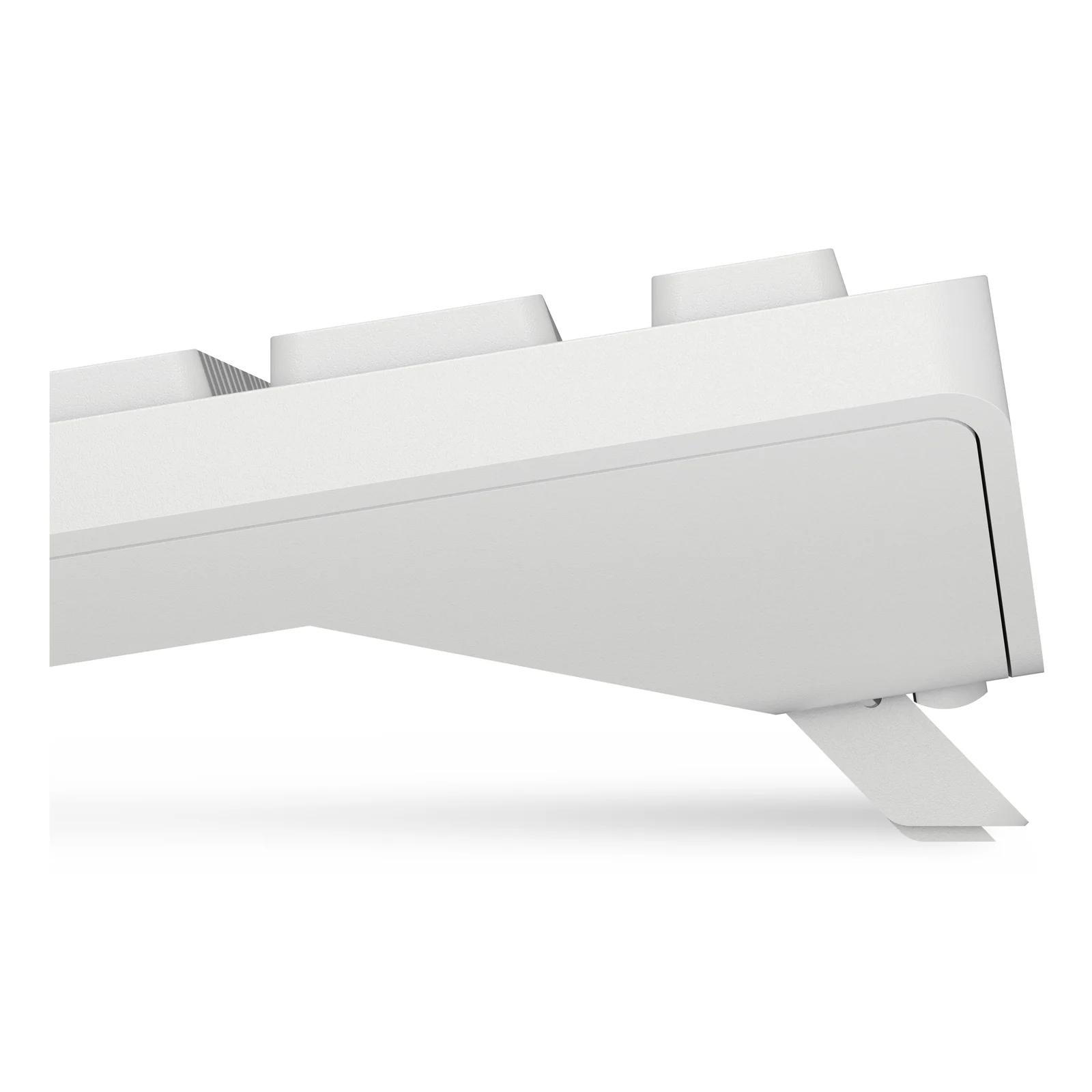Vue de profil du clavier blanc avec un pied inclinable déployé sous le châssis