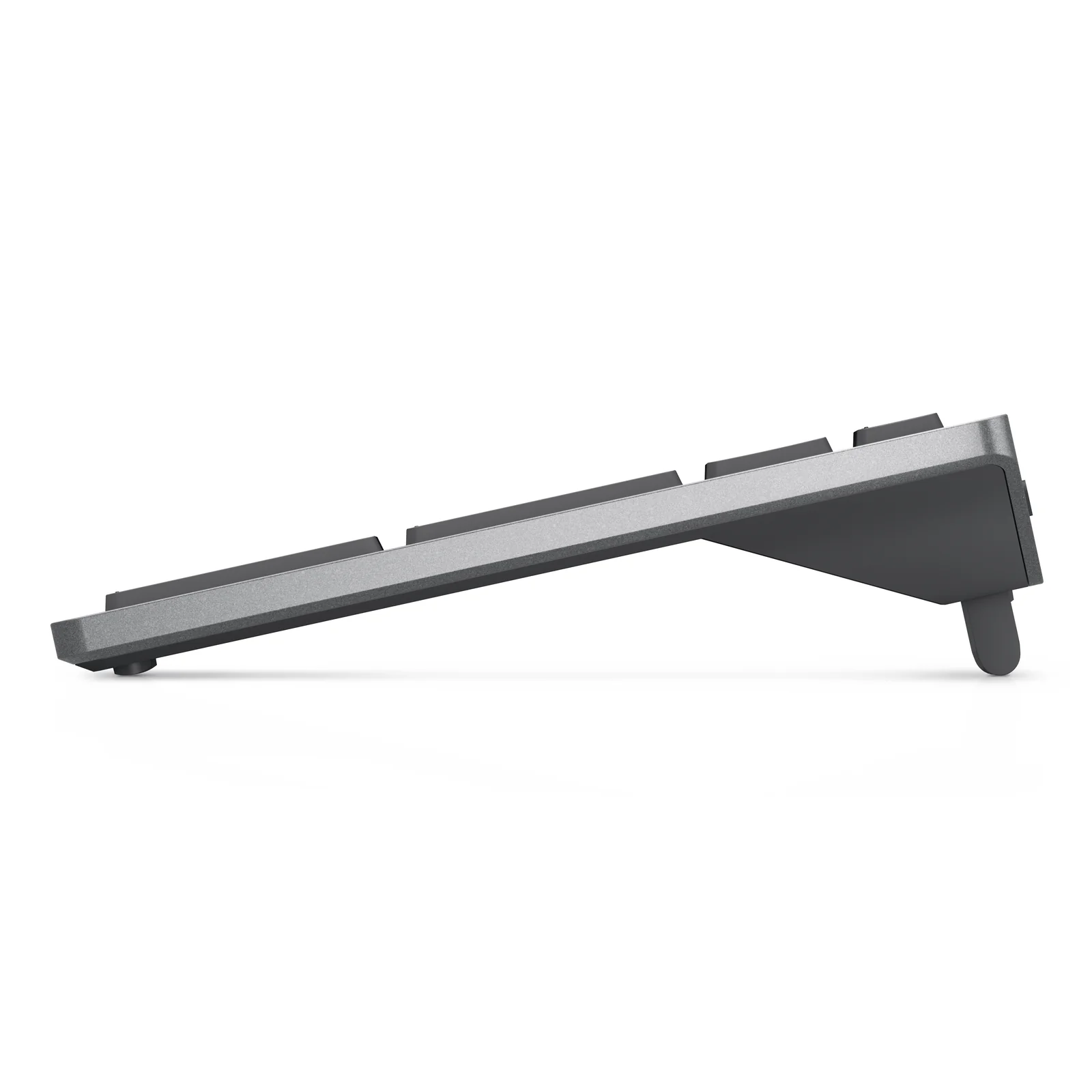 Vue de profil du clavier Dell KM7120W avec pieds arrière relevés, coloris gris titane
