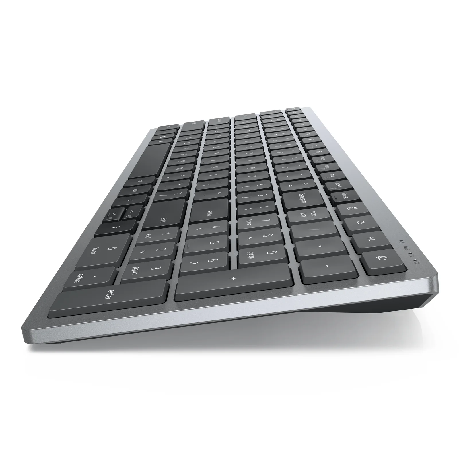 Vue latérale du clavier Dell KM7120W seul, angle gauche, touches bien visibles