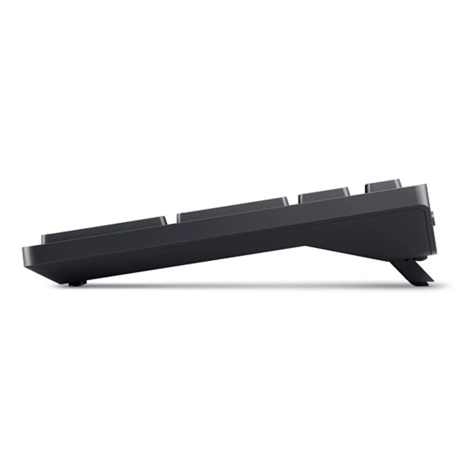 Clavier Dell KM555 noir vu de profil, profil fin, pieds inclinables en position repliée