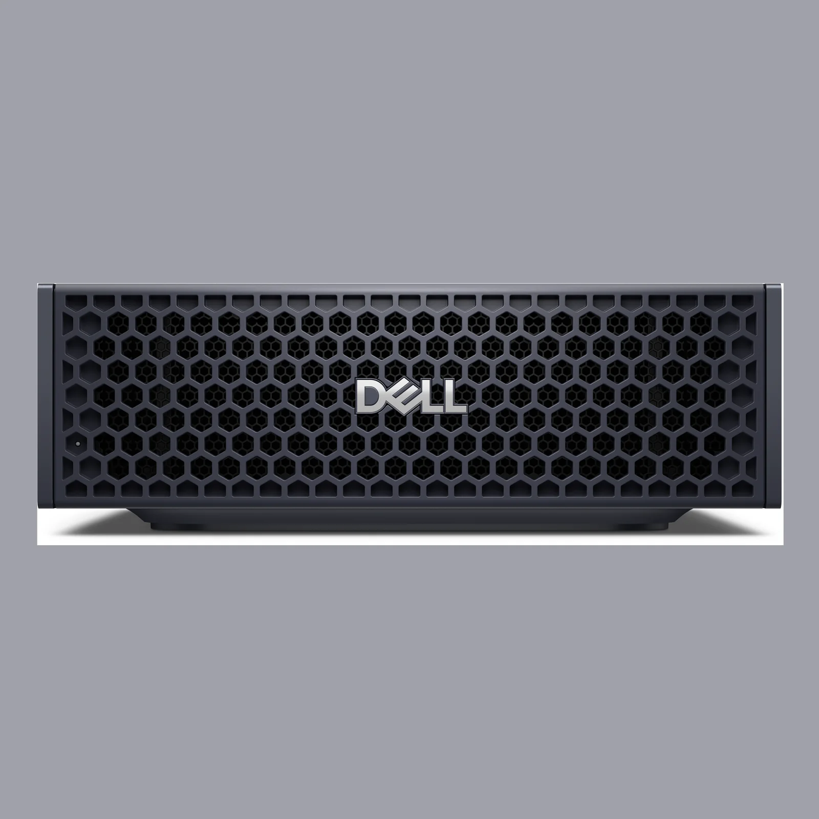Vue de face stricte du châssis montrant la large grille de ventilation hexagonale avec logo Dell central
