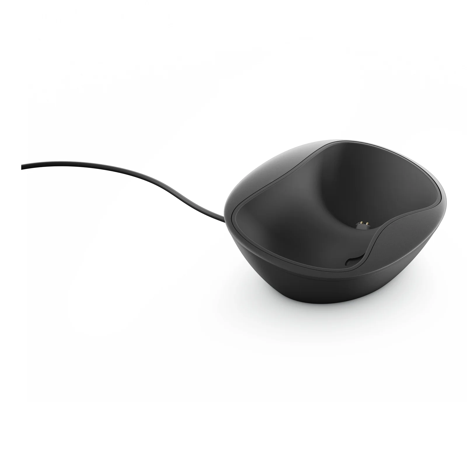 Station de charge filaire seule, coque noire avec contacts dorés visibles à l'intérieur