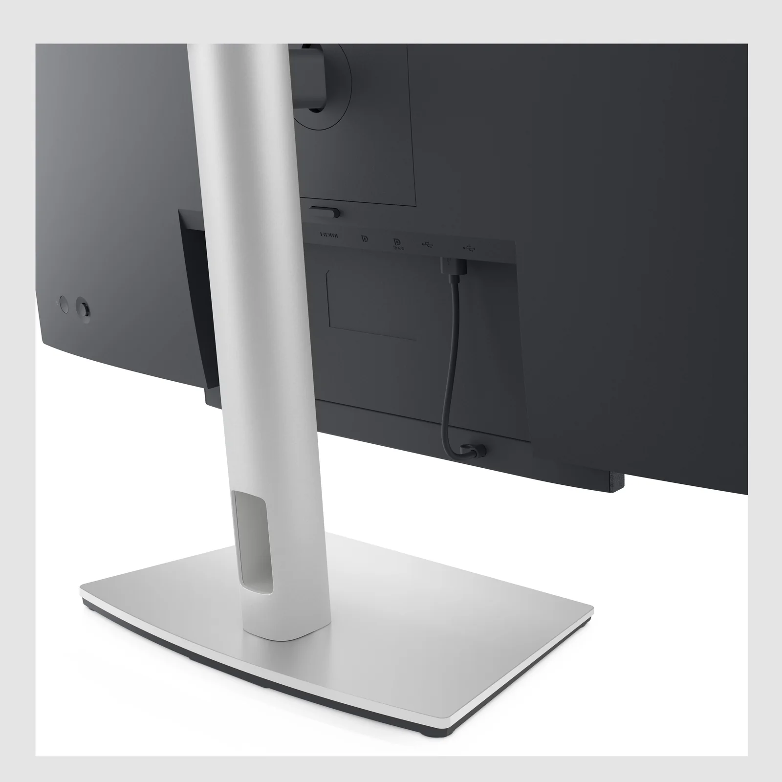 Détail rapproché de la barre de son fixée sous l'écran d'un moniteur Dell.
