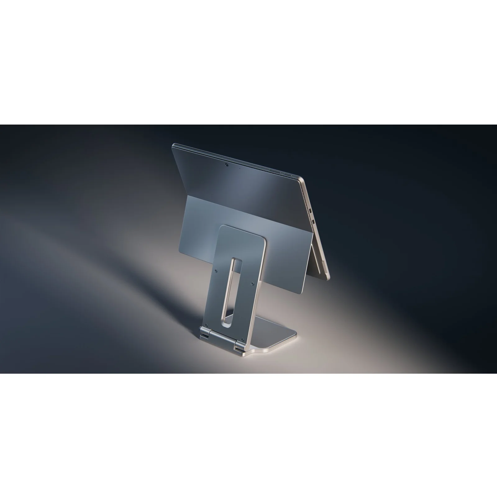 Stand Surface Pro sous éclairage sombre dramatique, angle avant gauche, fond noir