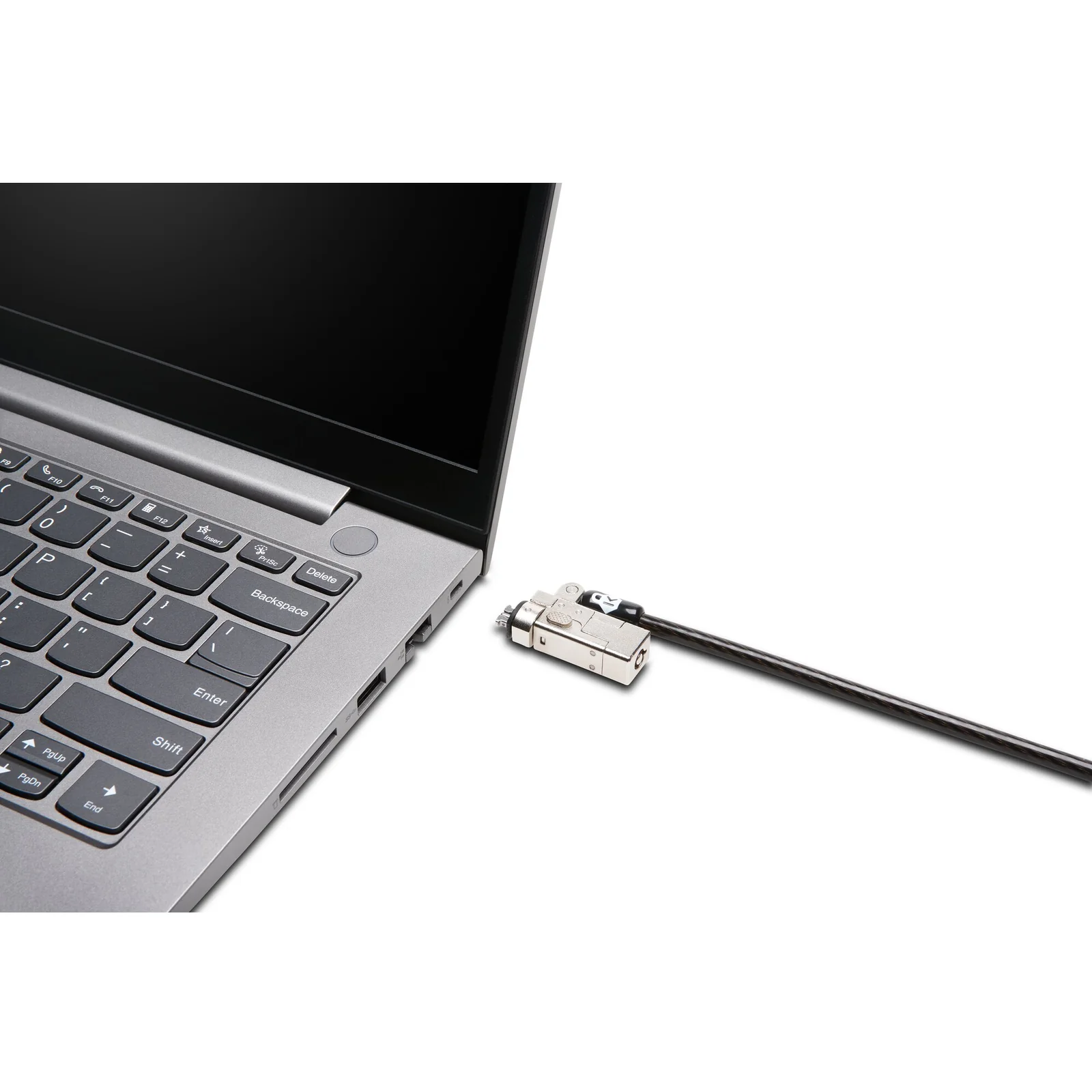Câble antivol Kensington NanoSaver 2.0 branché sur le port nano-encoche d'un ordinateur portable gris