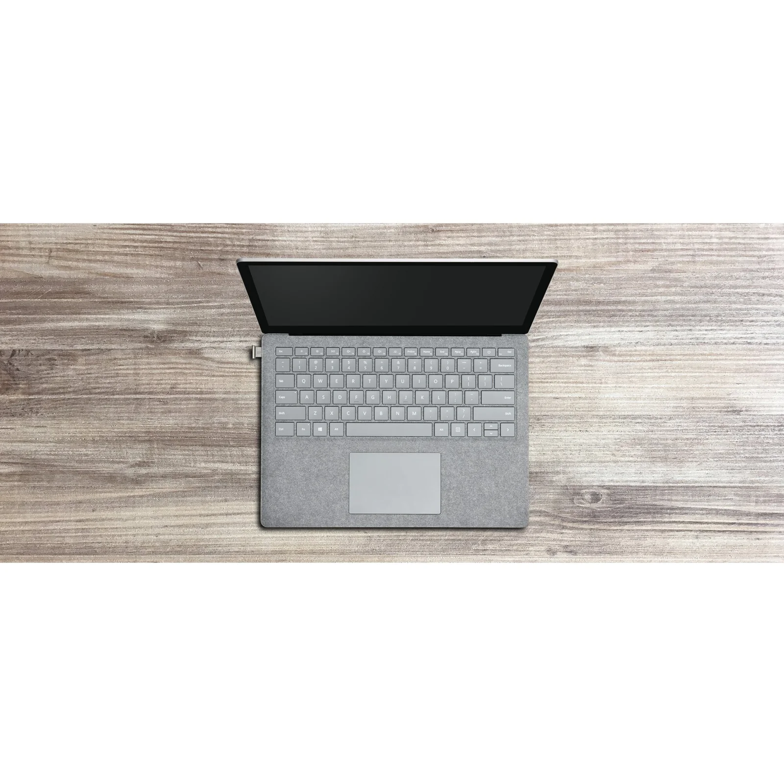 Vue aérienne d'un ordinateur portable sur bureau bois, clé VeriMark IT branchée