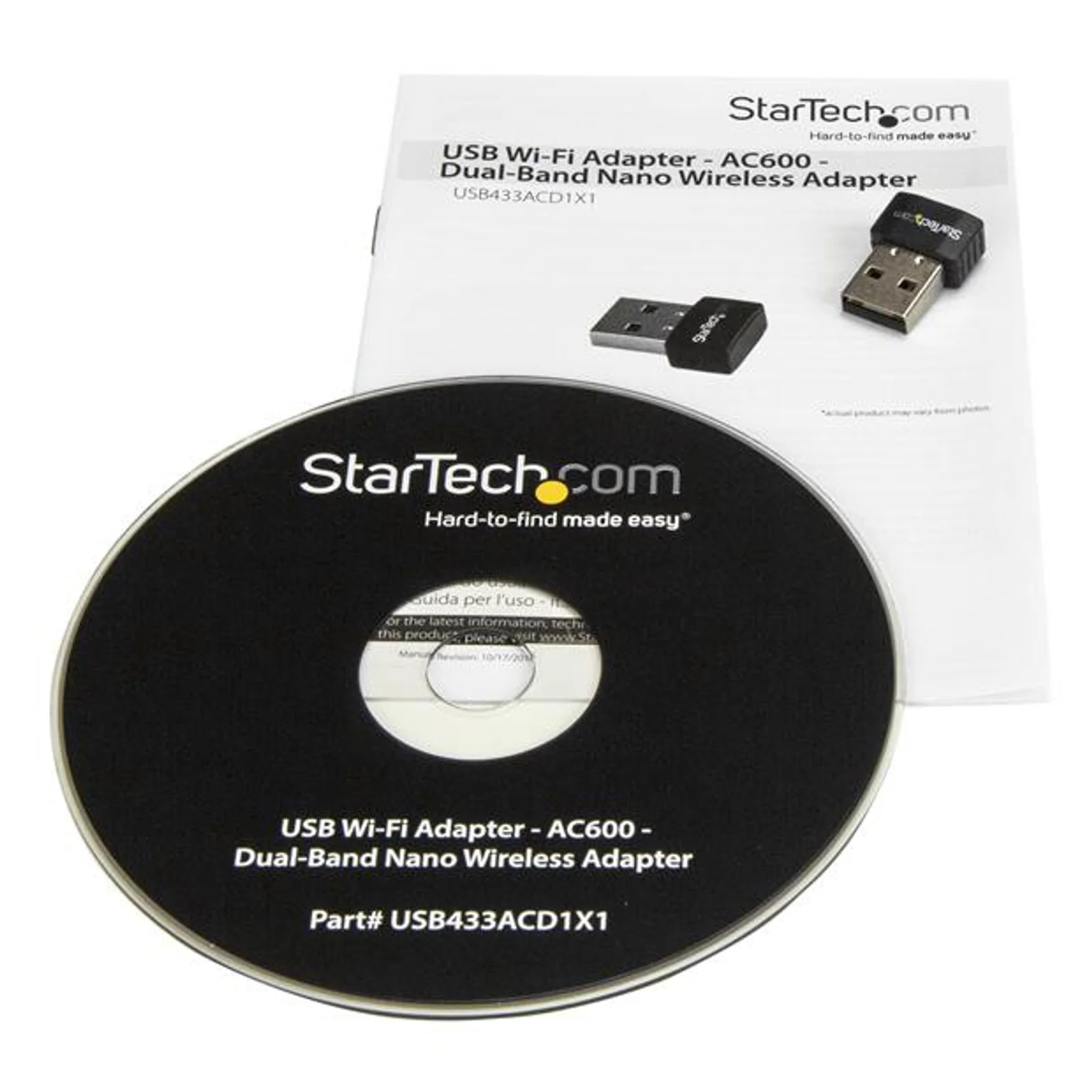 Contenu de la boîte avec un CD d'installation noir et un guide d'utilisation papier, adaptateur nano visible sur la couverture