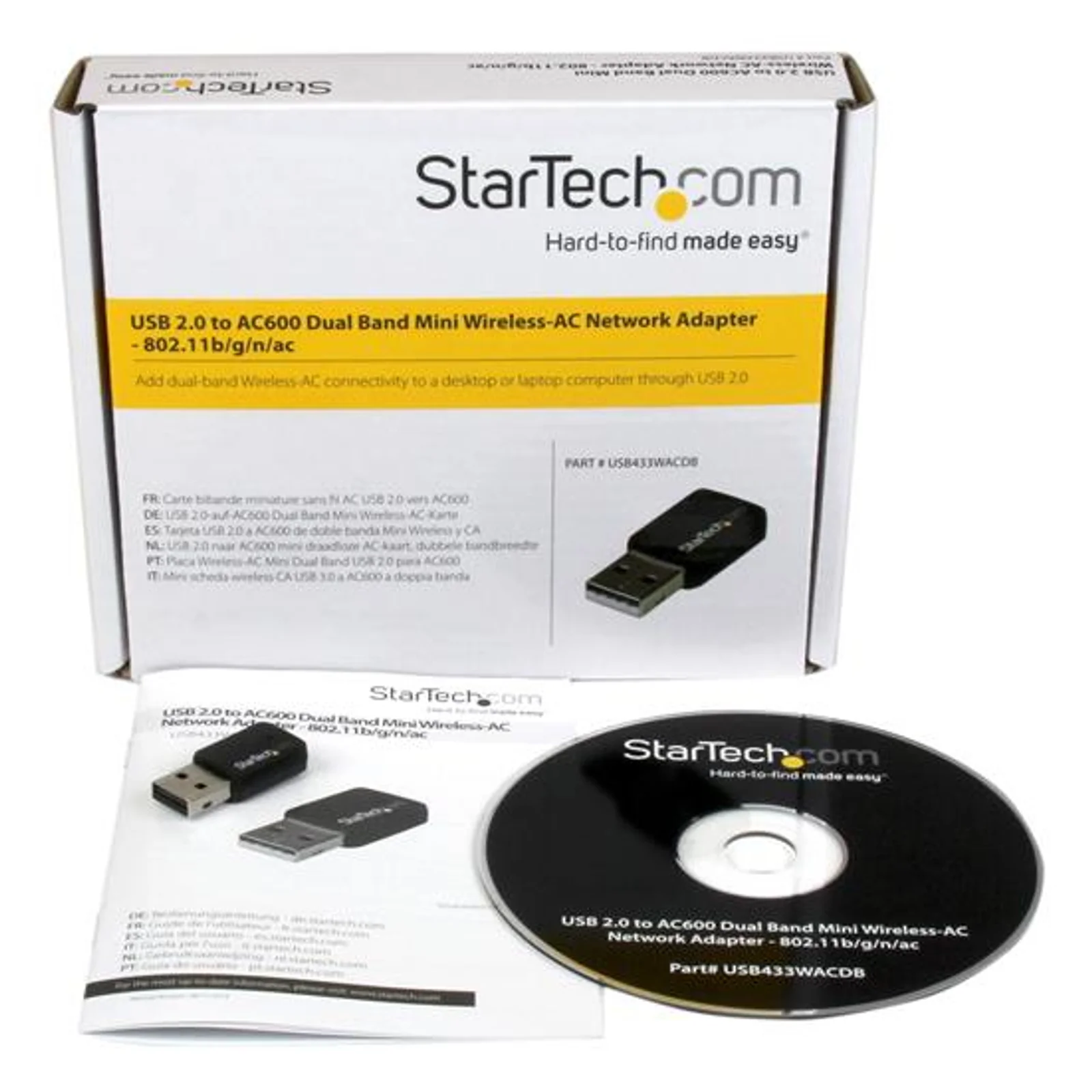 Contenu de la boîte, dongle USB noir, CD-ROM pilotes et guide de démarrage rapide sur fond blanc