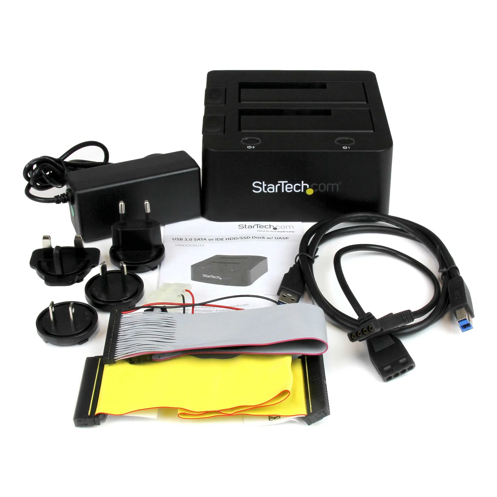 Contenu de la boîte étalé, station, adaptateur secteur universel, câble IDE ruban gris, nappe 2,5 pouces jaune, câble USB 3.0 et guide