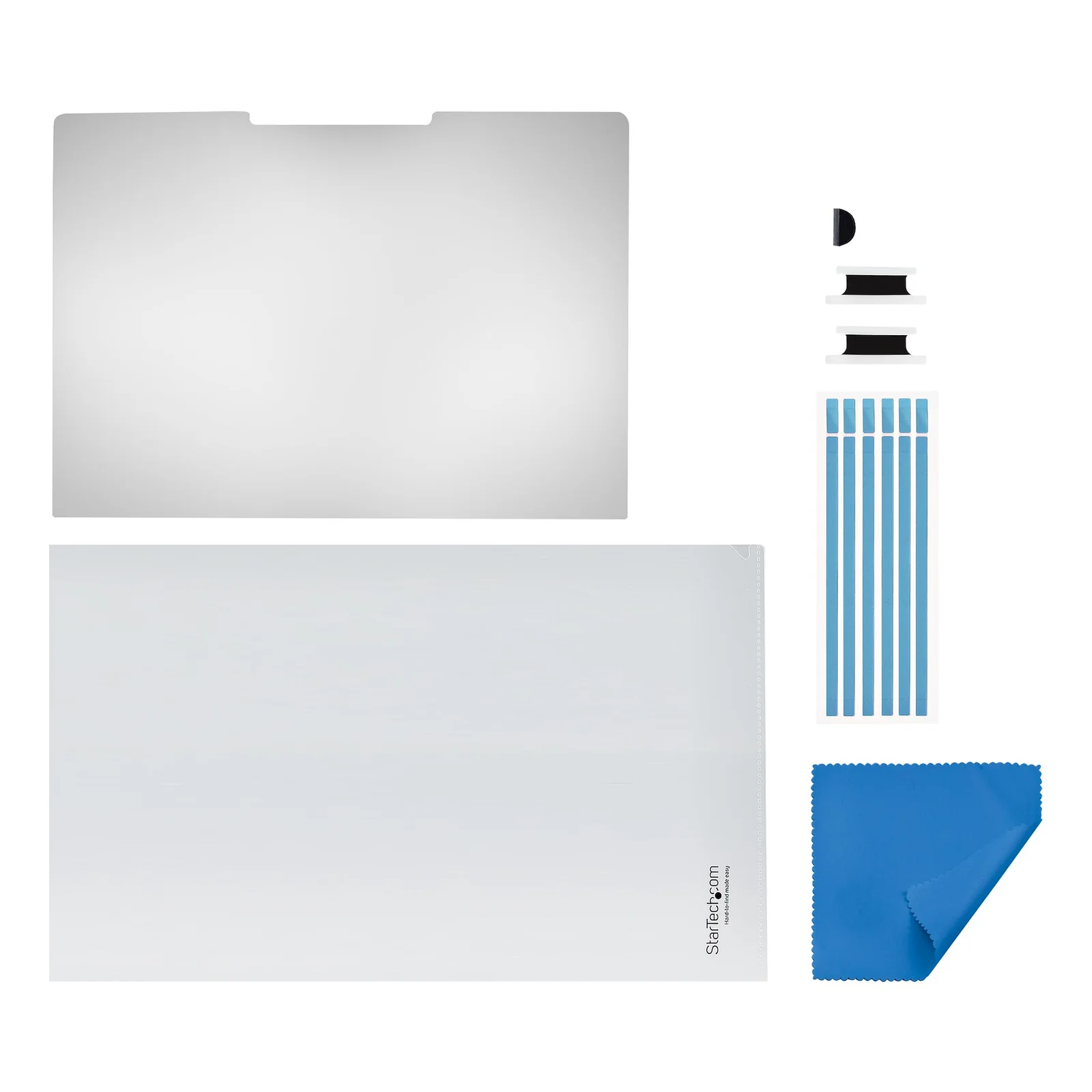 Contenu de la boîte disposé à plat, filtre, pochette de rangement, languettes pivotantes, bandelettes adhésives et chiffon de nettoyage