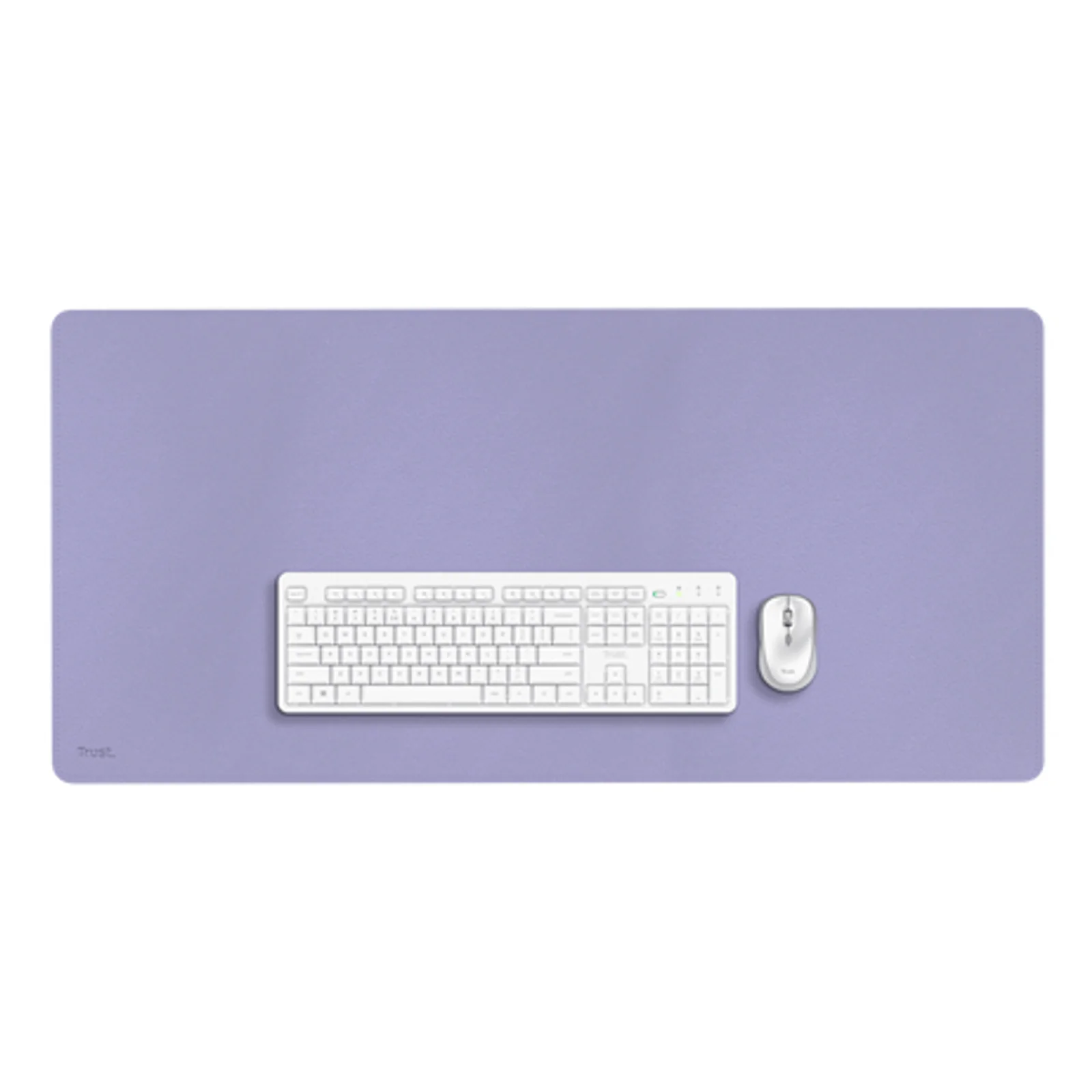 Trust Benya XXL sous-main violet avec clavier et souris blancs posés dessus, vue de dessus