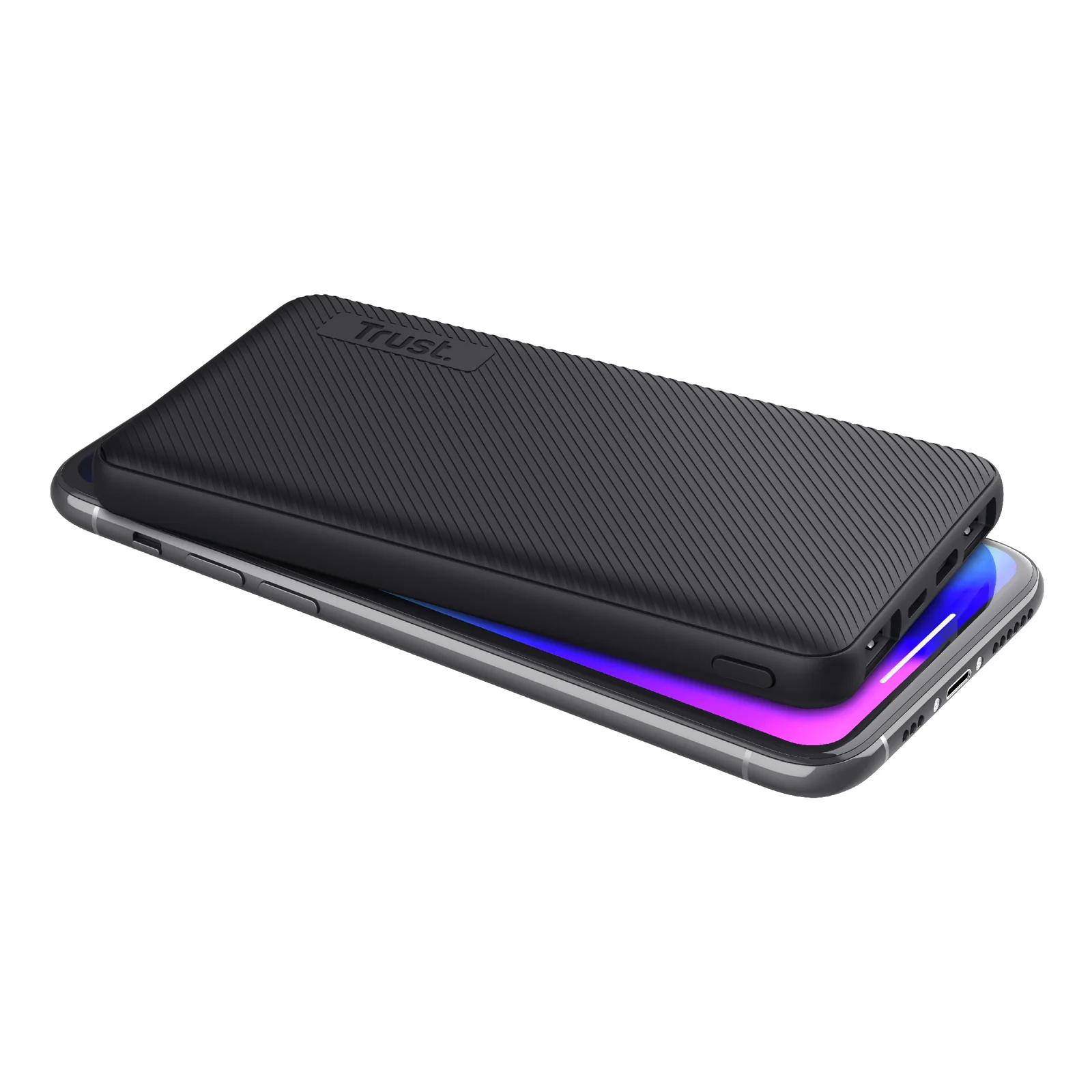 Trust Primo noir de profil ultra-plat à côté d'un smartphone, reflet violet