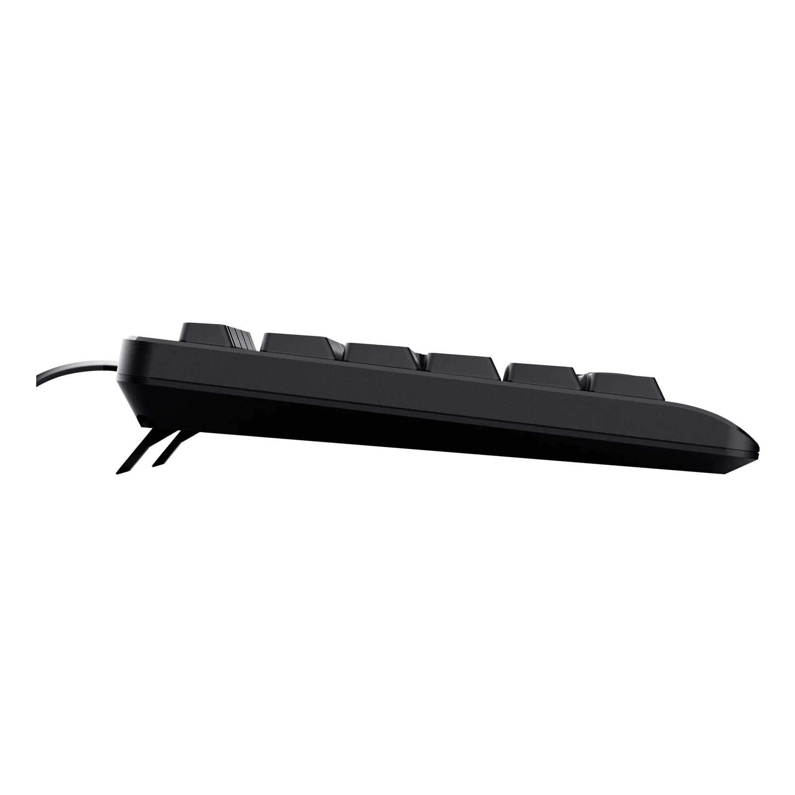 Vue de profil gauche, clavier Trust Primo noir, pieds réglables dépliés, câble USB visible