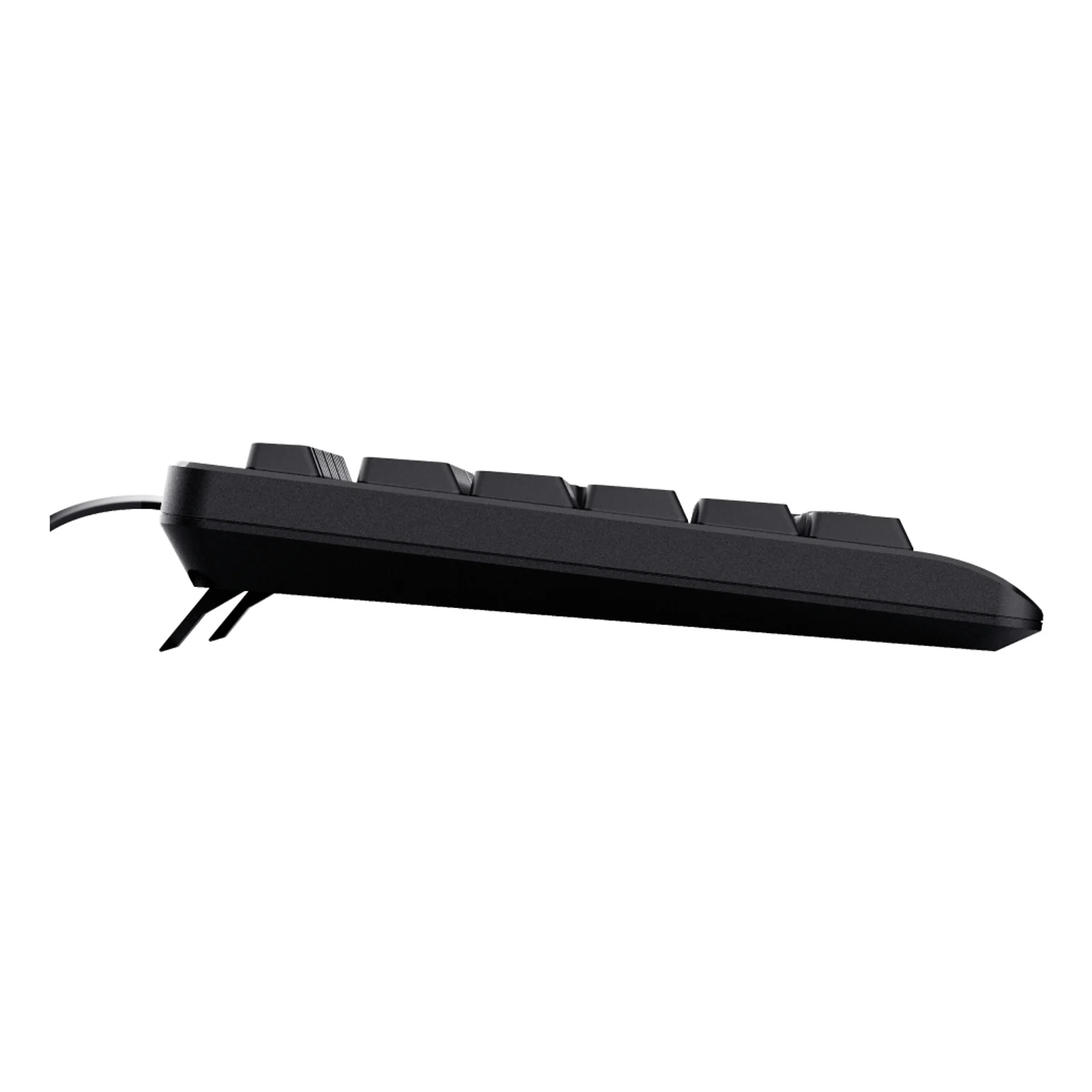 Vue de profil, clavier noir Trust TK-150 posé à plat, câble USB sortant à gauche